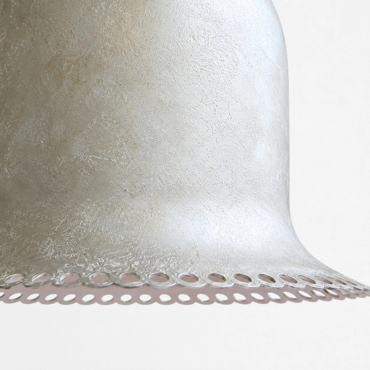 Close view of the aged surface and rim detail.