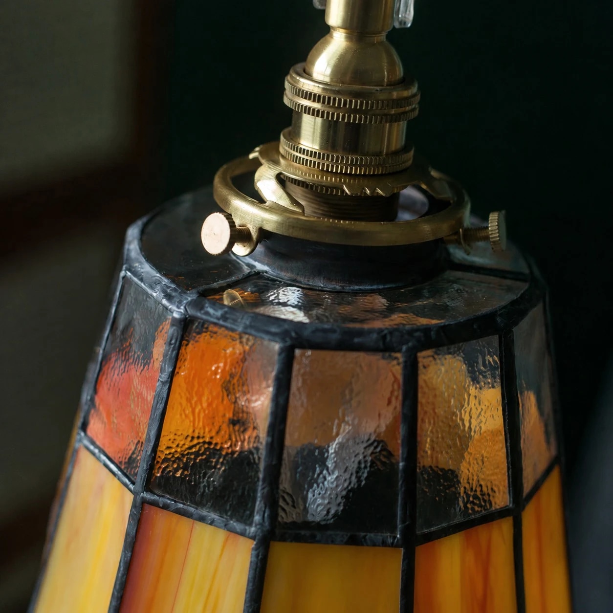 Close detail of brass fitting and glass shade